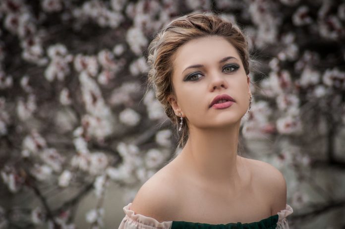 shallow-focus-photography-of-woman-near-cherry-blossom-tree-798731-696x462